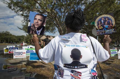 Obama supporter Tonya Lewis rallied for votes outside a polling station in Tampa, Florida.