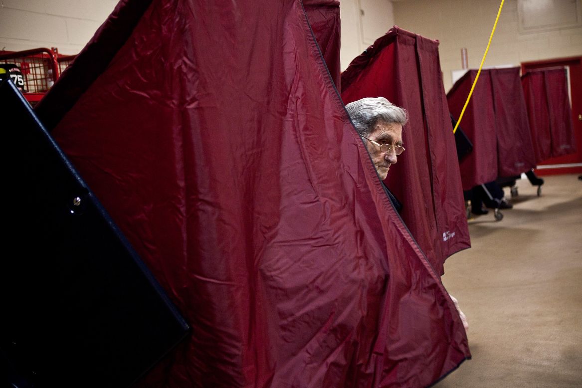 A man exits a voting booth at a fire station in Point Pleasant, New Jersey.  As the New Jersey coastline continues to recover from Superstorm Sandy, numerous polling stations have had to merge and relocate due to storm damage and power outages.
