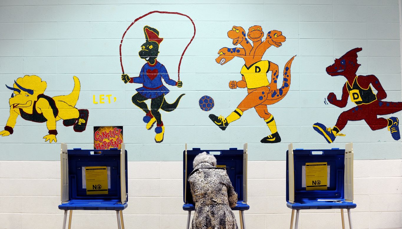 A voter casts her ballot in the gymnasium of Douglas Elementary School in Raleigh, North Carolina. 