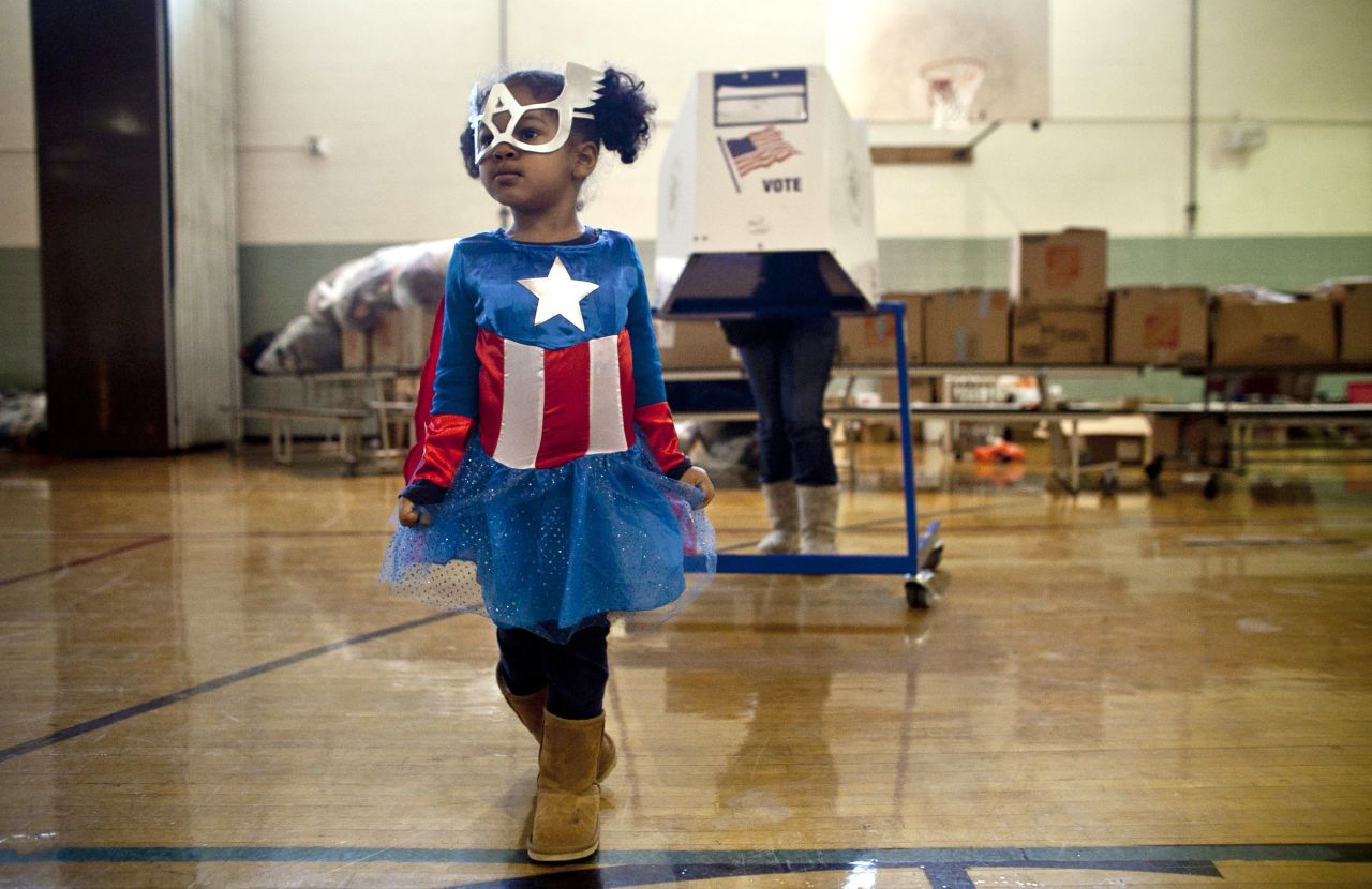 Raena Lamont, 3, wore a Captain America costume at a polling center Tuesday in Staten Island, New York. 