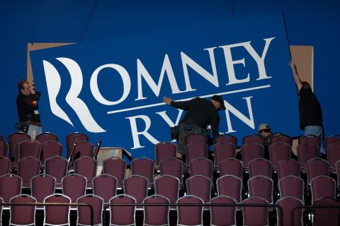 Workers put up signs Monday for Romney's election night event in Boston.
