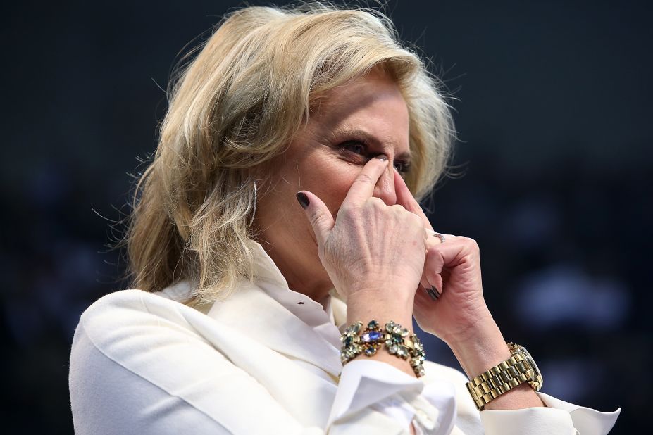 Ann Romney wipes away tears during her husband's campaign rally Monday in Manchester.
