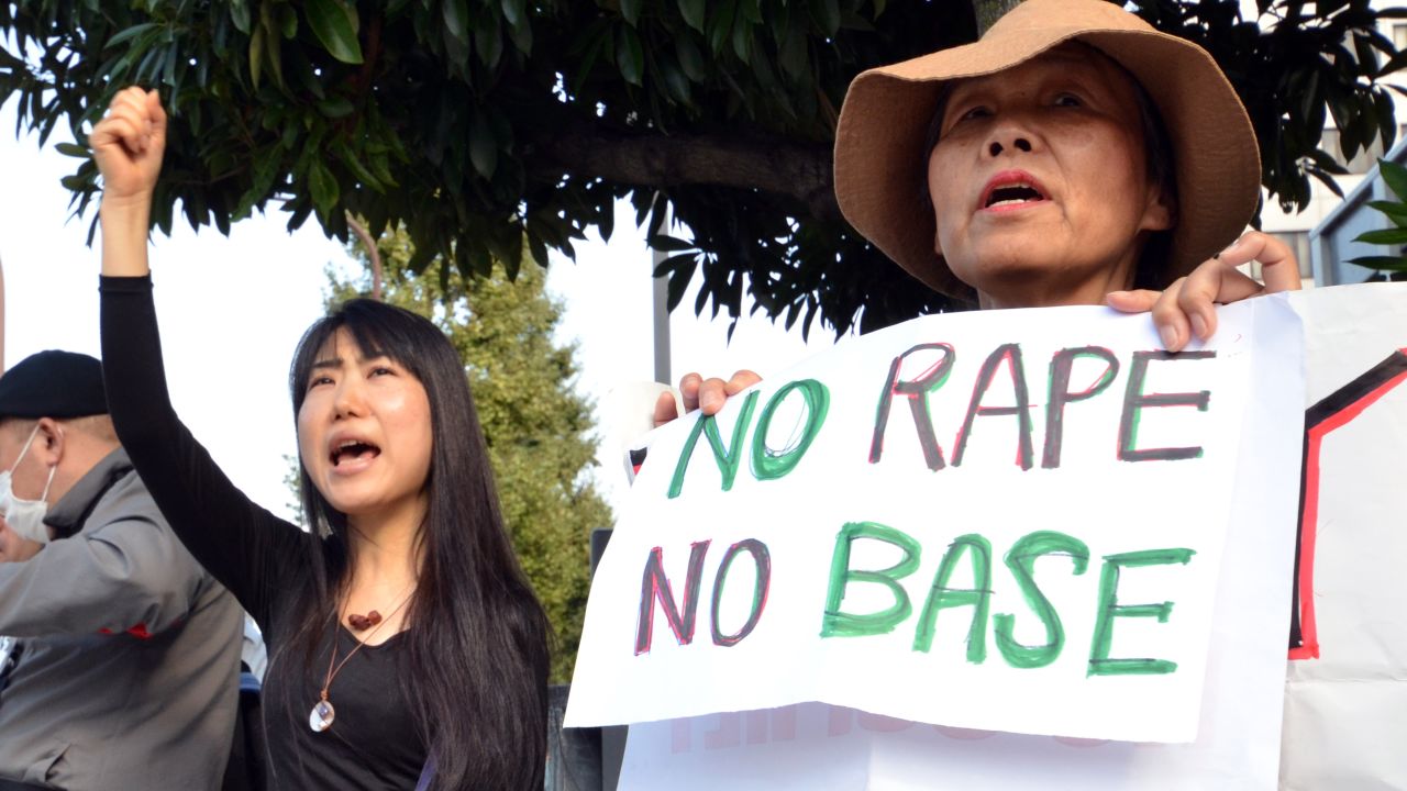 Civic groups in Tokyo protest the alleged rape of a Japanese woman by two U.S. servicemen on October 20.