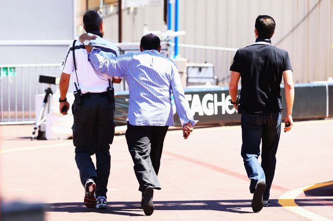 Perez's father, center, leaves the paddock after the F1 driver's crash during qualifying for the Monaco GP in 2011. Perez's younger brother Antonio is also involved in motorsport and drives in the NASCAR-sponsored race league in Mexico.