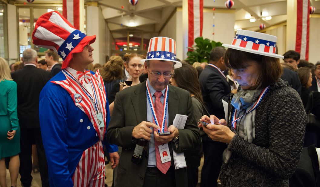 Party-goers wearing 'Stars and Stripes' clothing awaited results at an election night party at the U.S. Embassy in London.