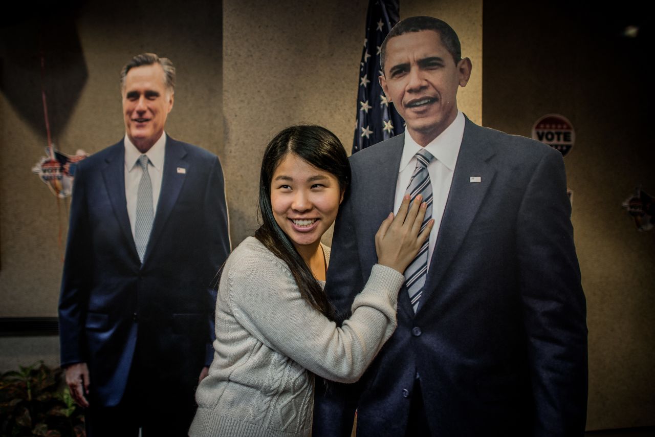 A student poses with a cutout of Obama on Wednesday at the U.S. Consulate in Hong Kong.