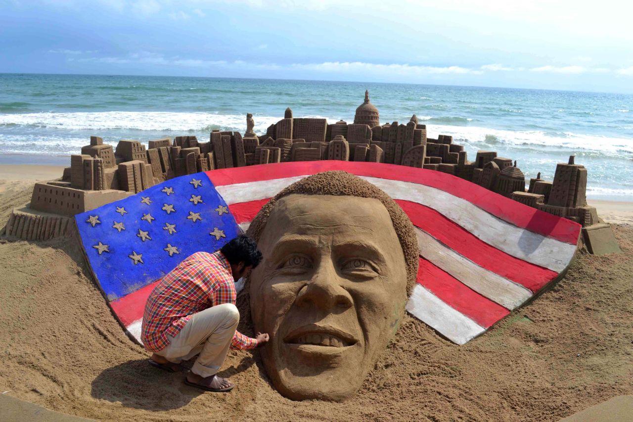 Indian artist Sudaran Pattnaik adds final touches to his sand sculpture of Obama at Golden Sea Beach in Puri, India, on Wednesday.