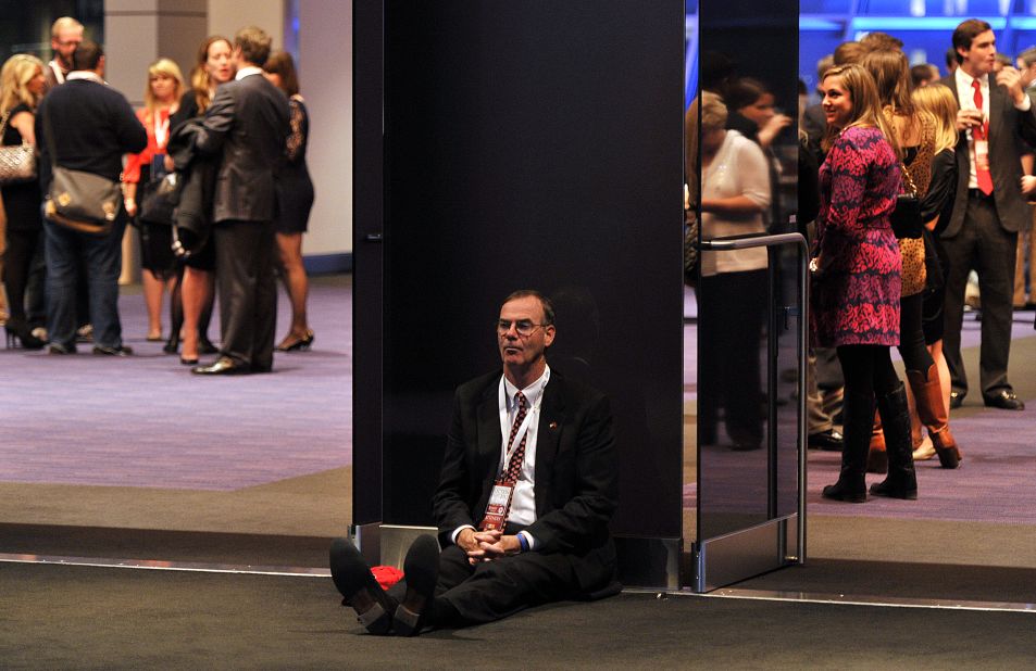 A dejected supporter of Republican candidate Mitt Romney slumped on the floor in Boston, Massachusetts.