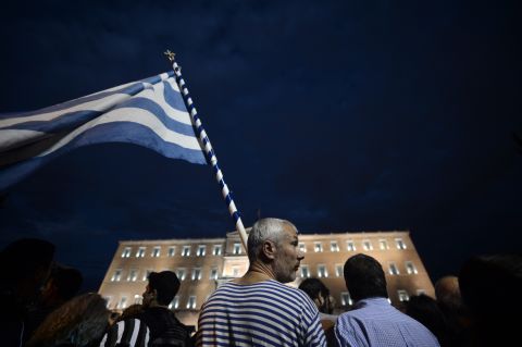 Demonstrators stand in front of the Greek Parliament in Athens on November 7, 2012 during a 48-hour general strike.