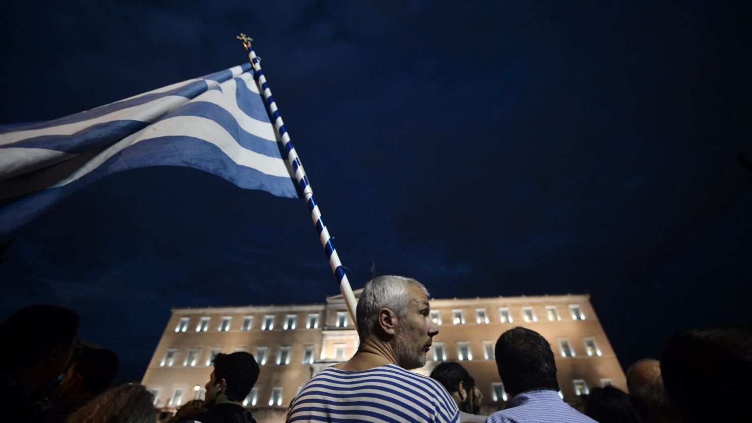 Demonstrators stand in front of the Greek Parliament in Athens on November 7, 2012 during a 48-hour general strike.