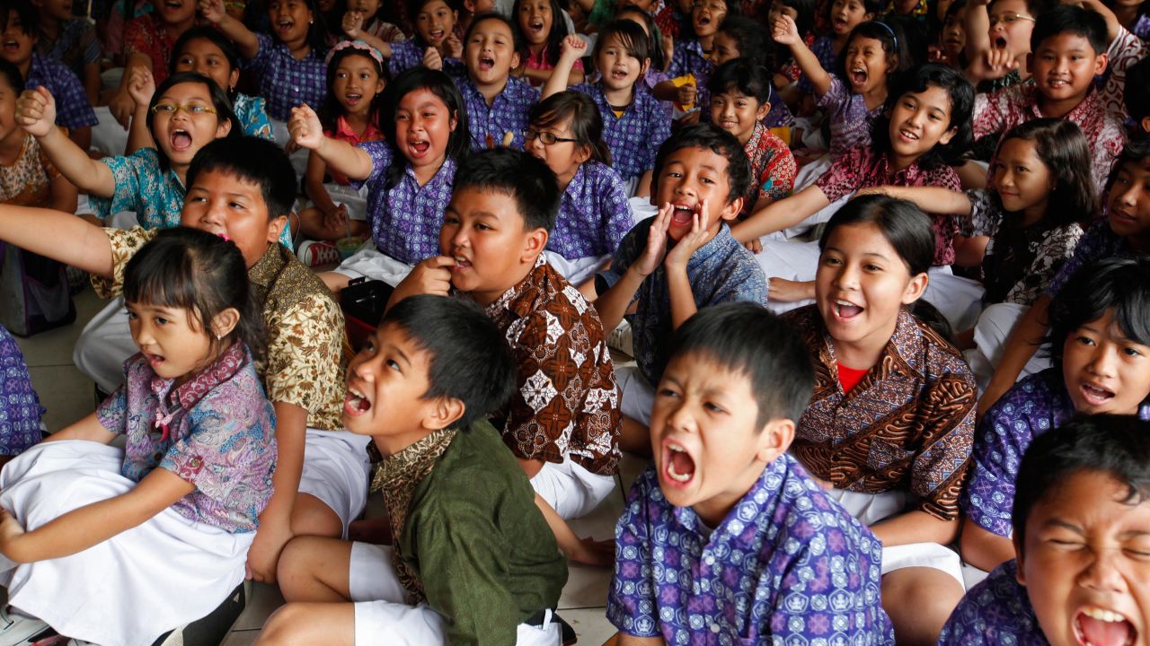 Students at the State Elementary School Menteng 01, where U.S. President Barack Obama studied from 1970-1971, cheer as they watch the U.S presidential election on television in Jakarta, Indonesia.