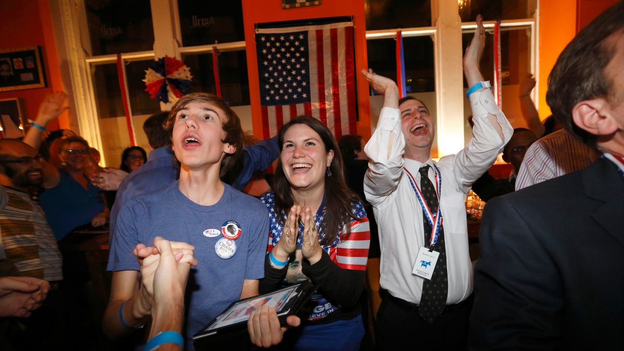 Obama supporters cheer during a U.S. election viewing party hosted by Democrats Abroad UK at the Sports Bar & Grill Marylebone in London, England.