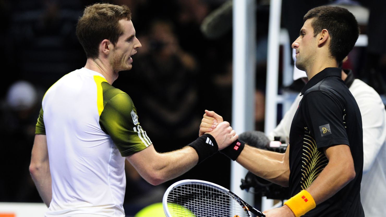 Andy Murray, left, congratulates Novak Djokovic after Djokovic the Serbian won their Group A  match on day three of the ATP World Tour Finals in London.