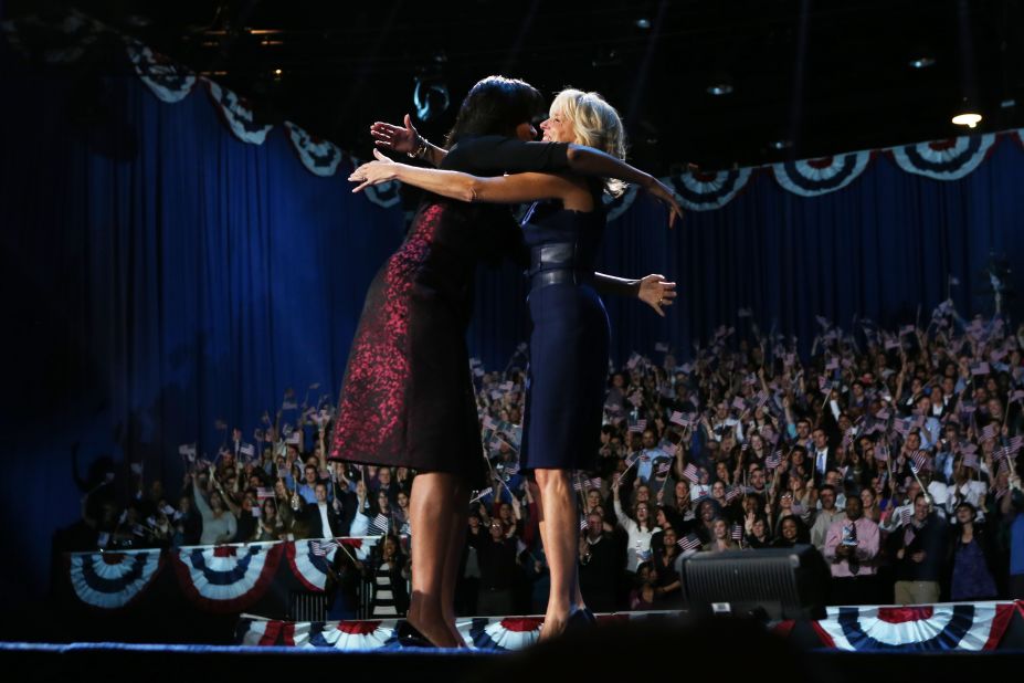 First lady Michelle Obama and Dr. Jill Biden hugged and will spend four more years in the public eye.  