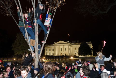 Children climbed trees outside the White House in Washington as people celebrated President Obama's victory at the polls. 