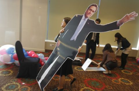 A South Korean woman carried a cardboard cutout of Republican Mitt Romney at an election night party in Seoul. South Koreans watched the race closely. 