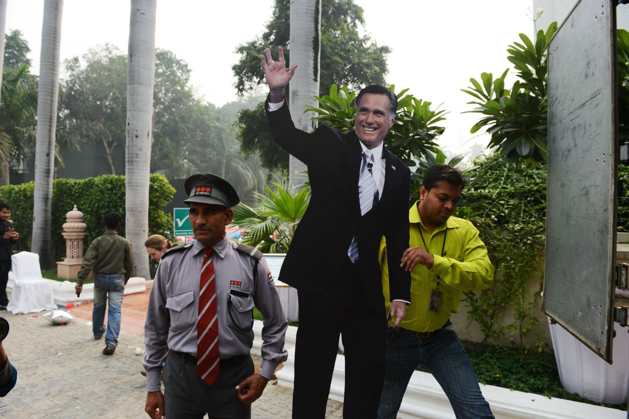 A cutout of U.S. presidential candidate Mitt Romney is carried away by a catering company worker after a U.S. embassy election party at a local hotel in Delhi on Wednesday. 
