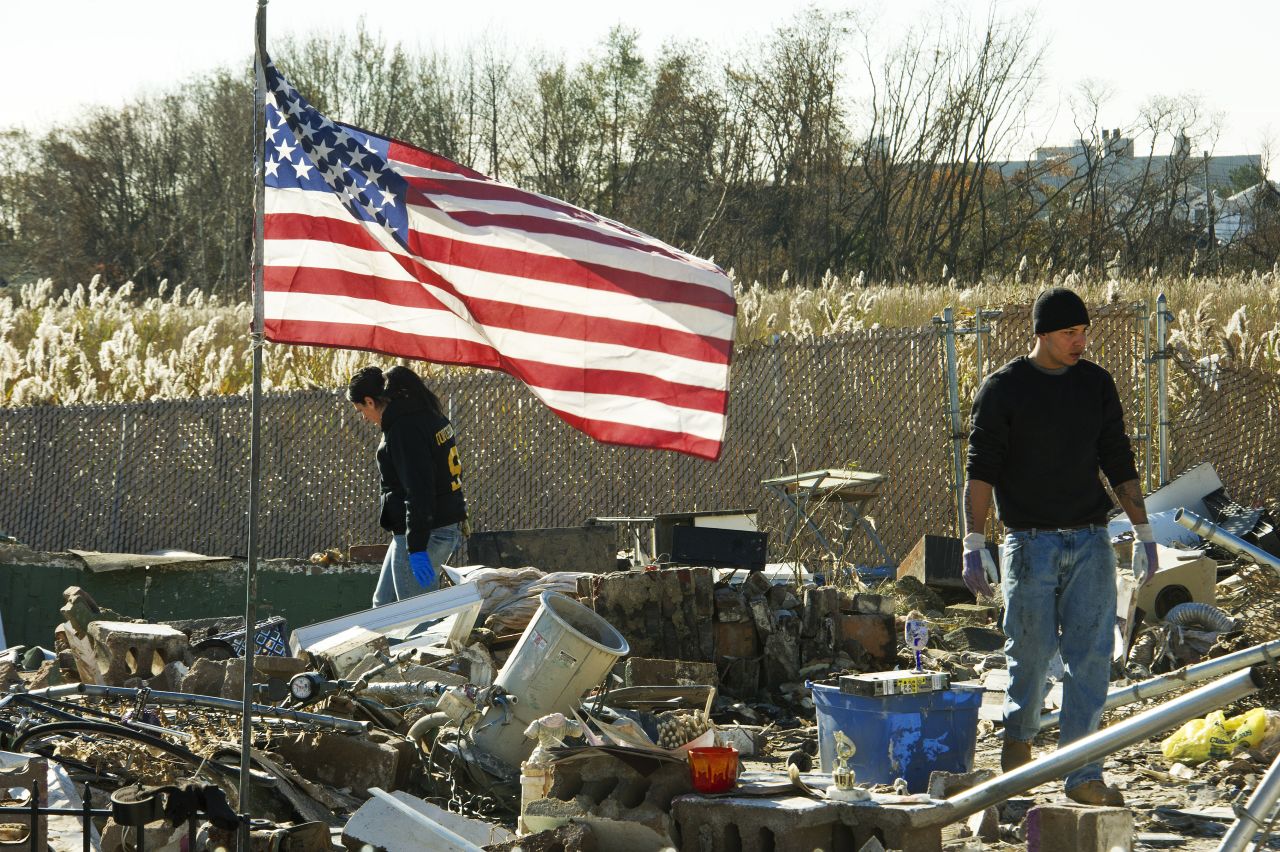 Friends and members of the Puglia family sift through the remains of their missing home for valuables on November 6, 2012, after Hurricane Sandy hit Staten Island, New York. <a href="http://www.cnn.com/2012/10/29/us/gallery/ny-braces-sandy/index.html">View photos of New York preparing for Sandy.</a>