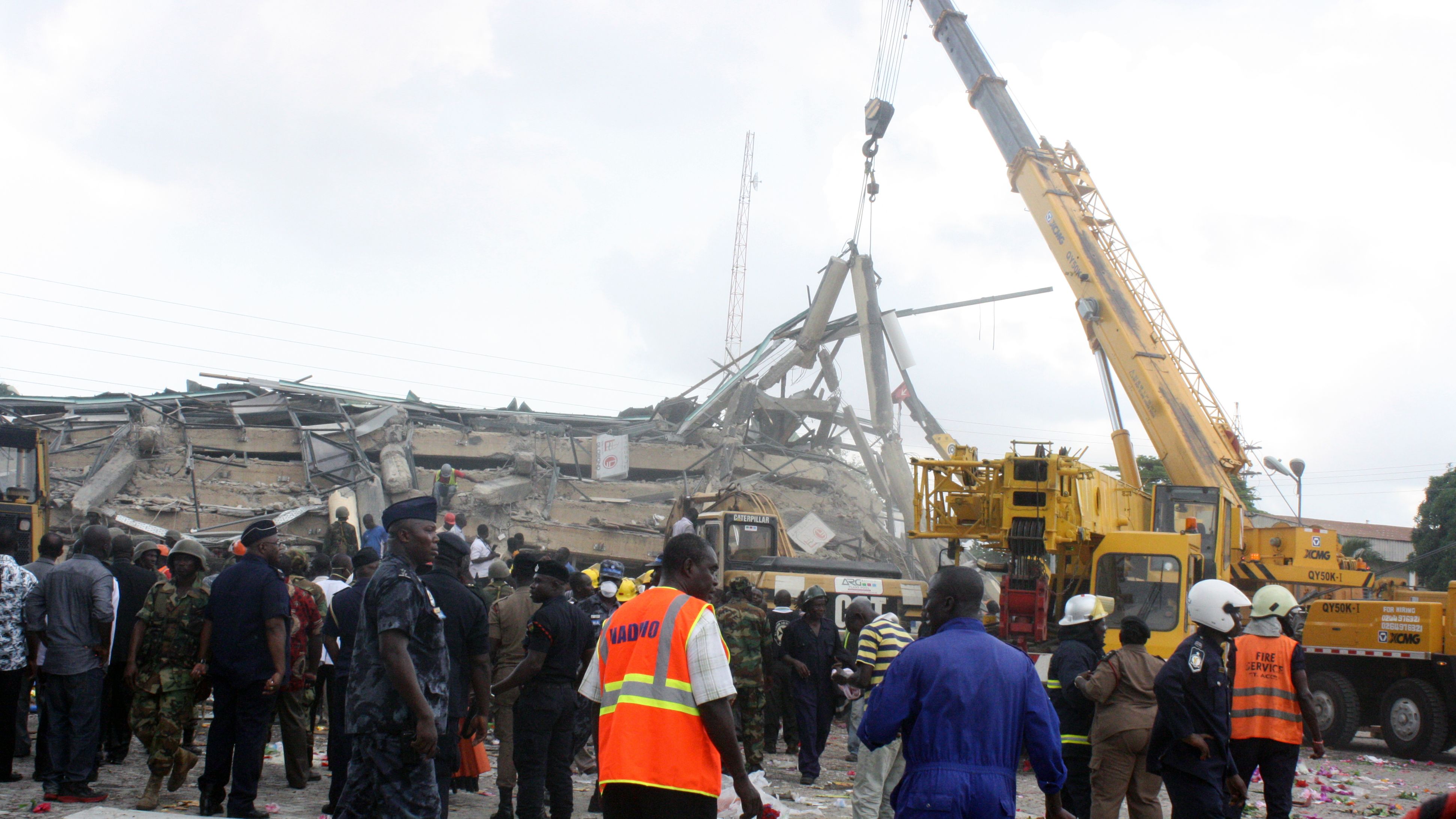 An excavator clears the remains of a shopping centre that collapsed on November 7, 2012 in Accra, killing at least three people.