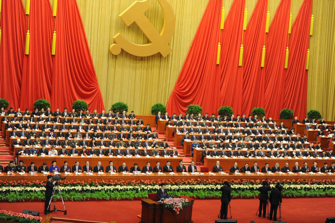 Chinese President Hu Jintao (seen at the very bottom) addresses delegates on November 8.