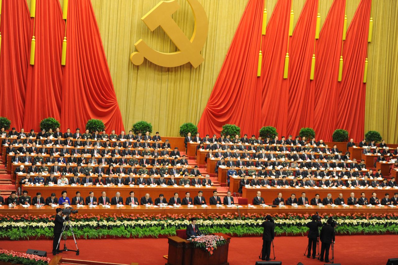 Chinese President Hu Jintao (seen at the very bottom) addresses delegates on November 8.
