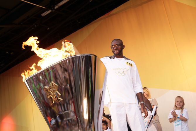 Muamba took part in the Olympic torch relay for the London 2012 Games. Here he lights the cauldron on day 64 of the flame's 8,000-mile journey around the UK.