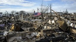 The remains of over a hundred homes lay a burnt out husk in Rockaway, NY on Thursday.