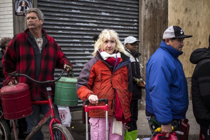 Anne Wyley, 55, waits in line for gas in Far Rockaway, Queens, where she had major damage to her home and remains without power.