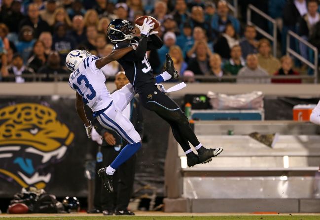 Aaron Ross of the Jacksonville Jaguars goes up for an interception against T.Y. Hilton of the Indianapolis Colts on Thursday, November 8, at EverBank Field in Jacksonville, Florida.