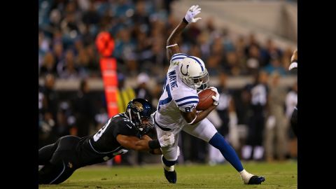 Colts wide receiver Reggie Wayne is tackled after a catch Thursday.