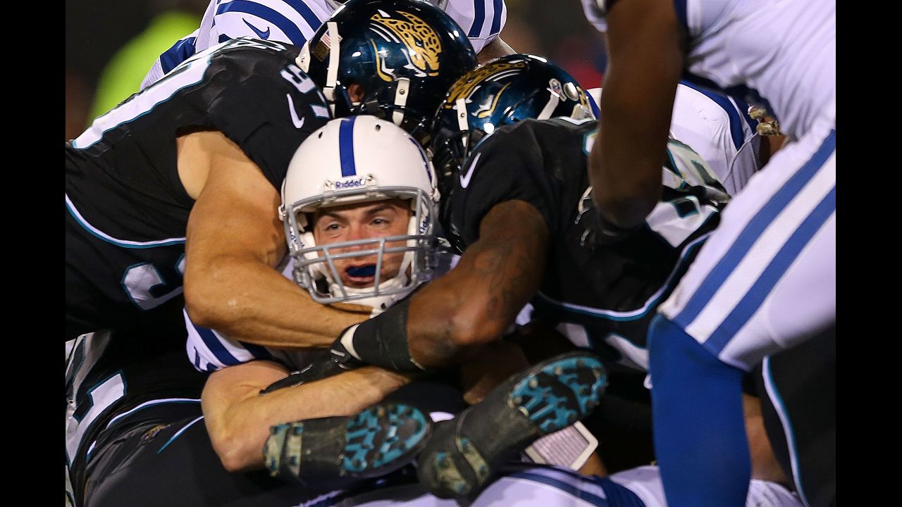Colts quarterback Andrew Luck scores a touchdown Thursday.