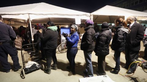 Voters wait at a makeshift polling place in the hurricane-devastated Rockaway neighborhood of Queens, New York. 