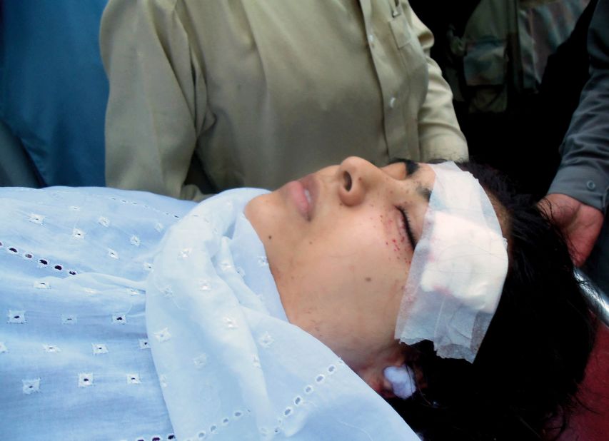 Pakistani hospital workers carry Malala on a stretcher on October 9, 2012 after she was shot in the head by the Taliban in Mingora.