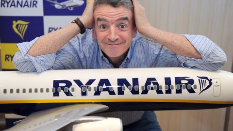 Michael O'Leary, CEO of Irish airline Ryanair, poses on a model Ryanair airplane on August 23, 2012.