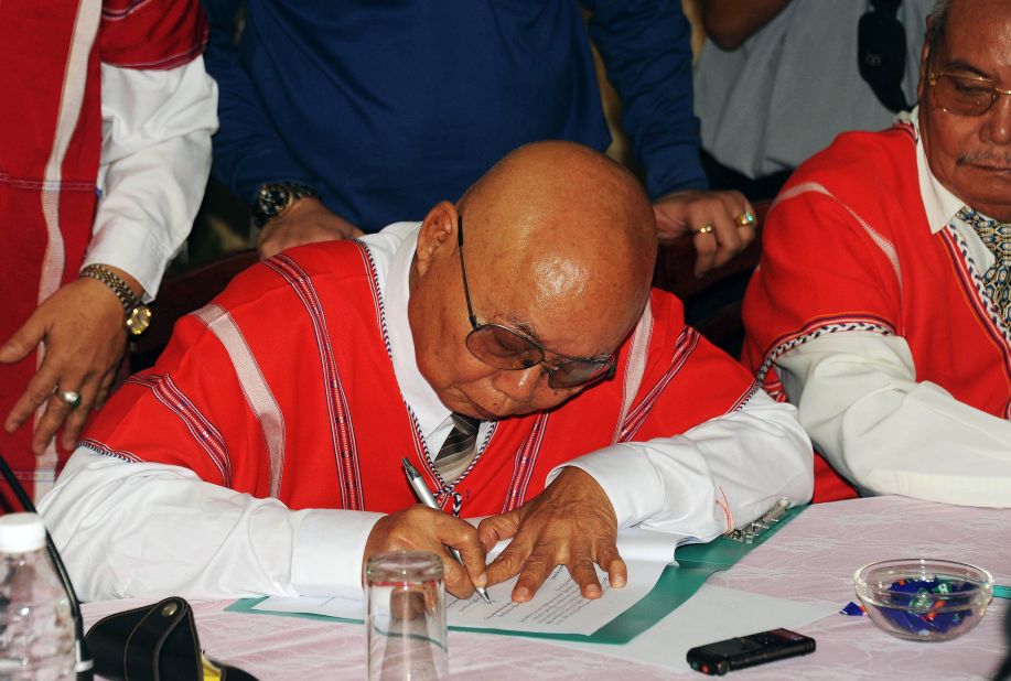 A representative of the rebel Karen National Union (KNU) signs a document during ceasefire talks with a Myanmar government delegation in  Karen state. Myanmar's government and the KNU, one of the country's leading ethnic rebel groups, signed a ceasefire on January 12, raising hopes of an end to one of the world's longest-running civil conflicts. 