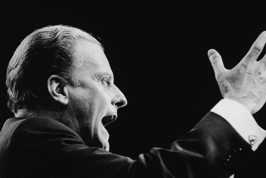 Graham addresses the congregation at the opening of a 32-day London crusade in 1966.