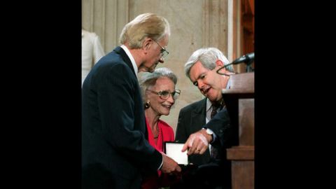 In 1996, House Speaker Newt Gingrich presents Graham with a Congressional Gold Medal during a ceremony on Capitol Hill.