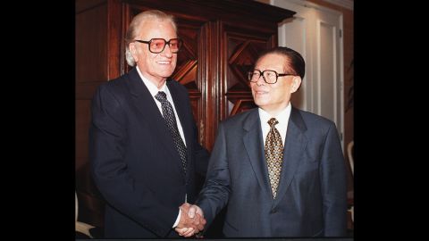 Graham greets Chinese President Jiang Zemin at a California luncheon in 1997.