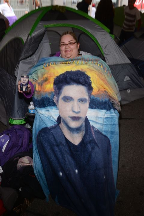 A fan shows off her "Twilight" phone case and blanket.