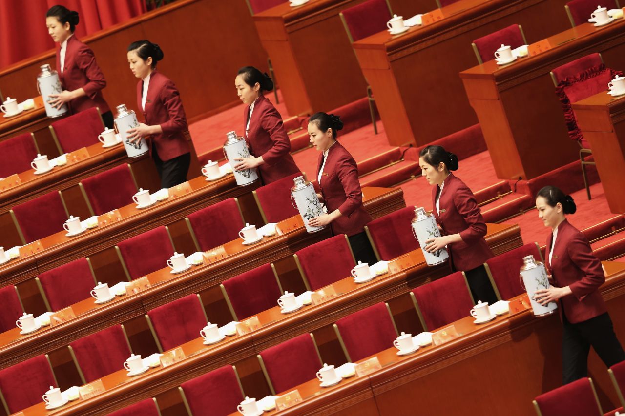 Attendants serve tea during the 18th Communist Party Congress.