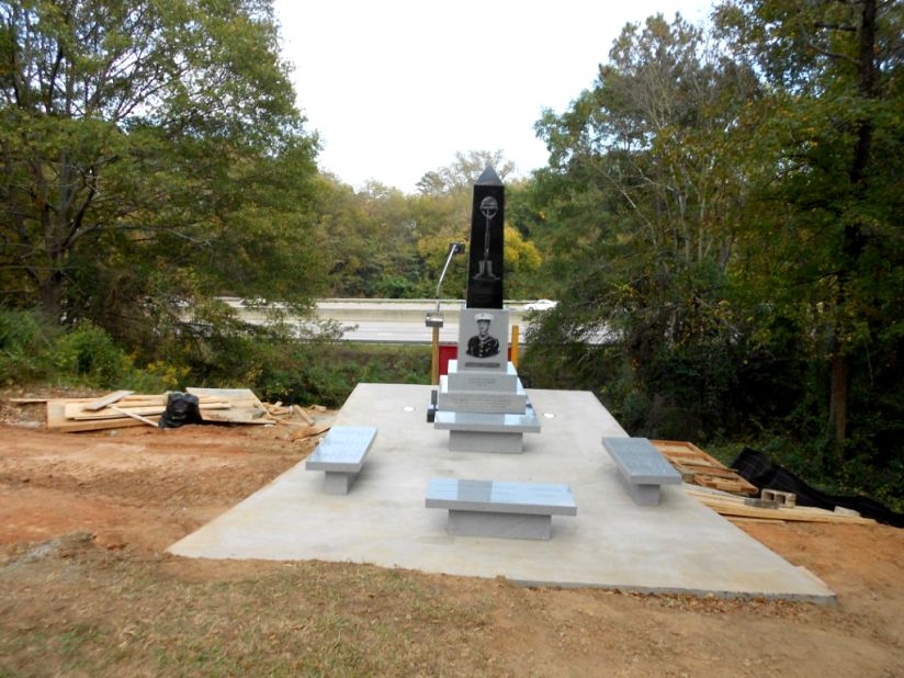 This monument will replace the wooden sign overlooking I-75.  Visitors will be able to sit on four benches, reflecting on Davis' bravery and the text written on the lighted black and gray granite monument. The obelisk features a likeness of Davis and an etching of a helmet, rifle and boots forming a cross. One panel reads: "May this monument be a beacon of love that shines on all those who contribute to the many efforts needed to completely restore Linwood Cemetery."