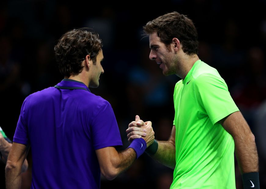 Juan Martin Del Potro, right, shakes hands with Roger Federer after qualifying for the semifinals of the  ATP World Tour Finals with victory over the 17-time grand slam champion. 