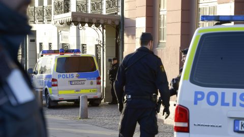 Policemen stand outside the Swedish Prime Minister's residence, Sagerska Palace, in Stockholm on November 9, 2012