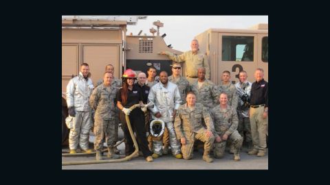 Crime author Michael Connelly (top row)  visits with troops while on the Operation Thriller USO tour. 