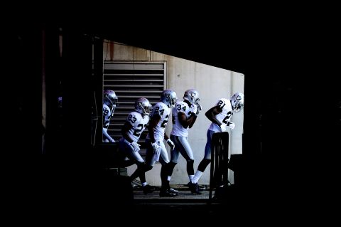 The Oakland Raiders take the field before playing the Baltimore Ravens at M&T Bank Stadium on Sunday in Baltimore, Maryland. 