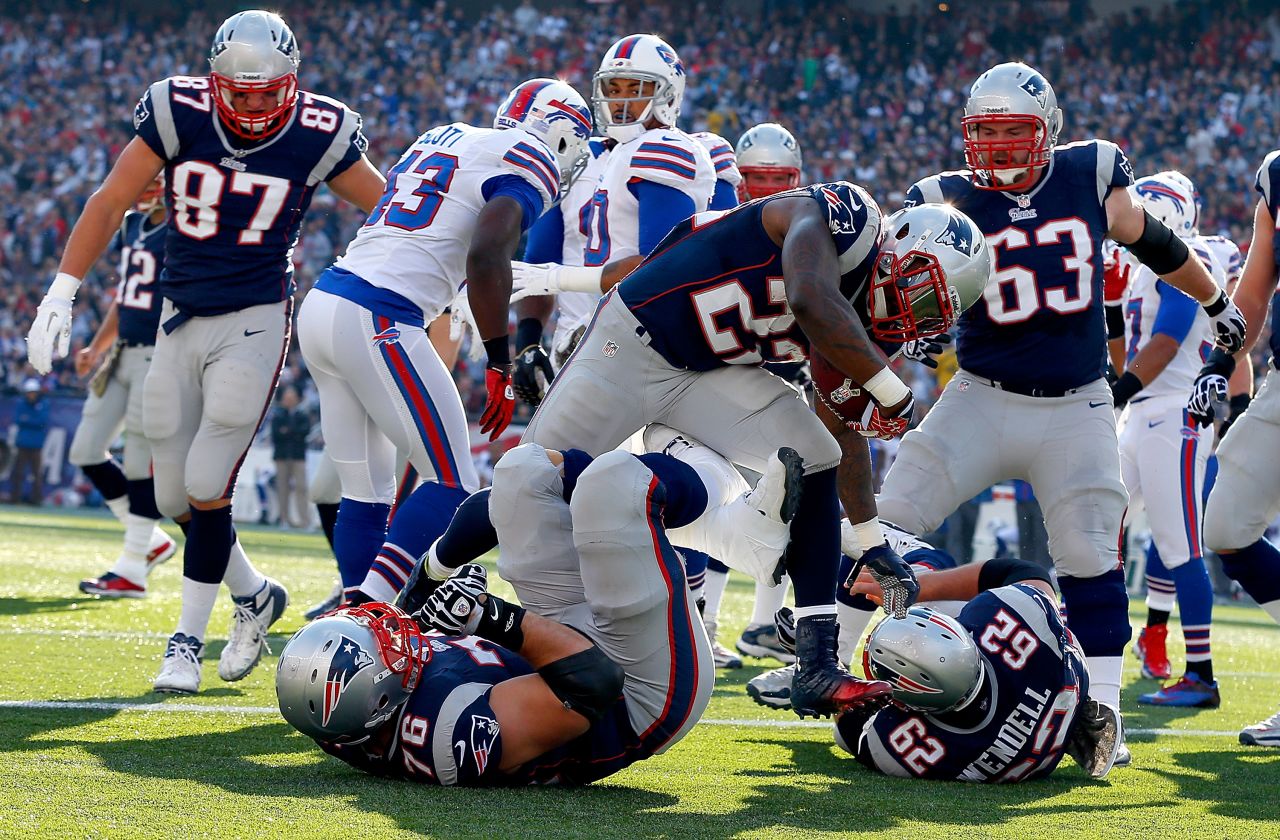 No. 22 Stevan Ridley of the New England Patriots runs the ball into the end zone for a touchdown in the first half on Sunday against the Buffalo Bills at Gillette Stadium in Foxboro, Massachusetts. 