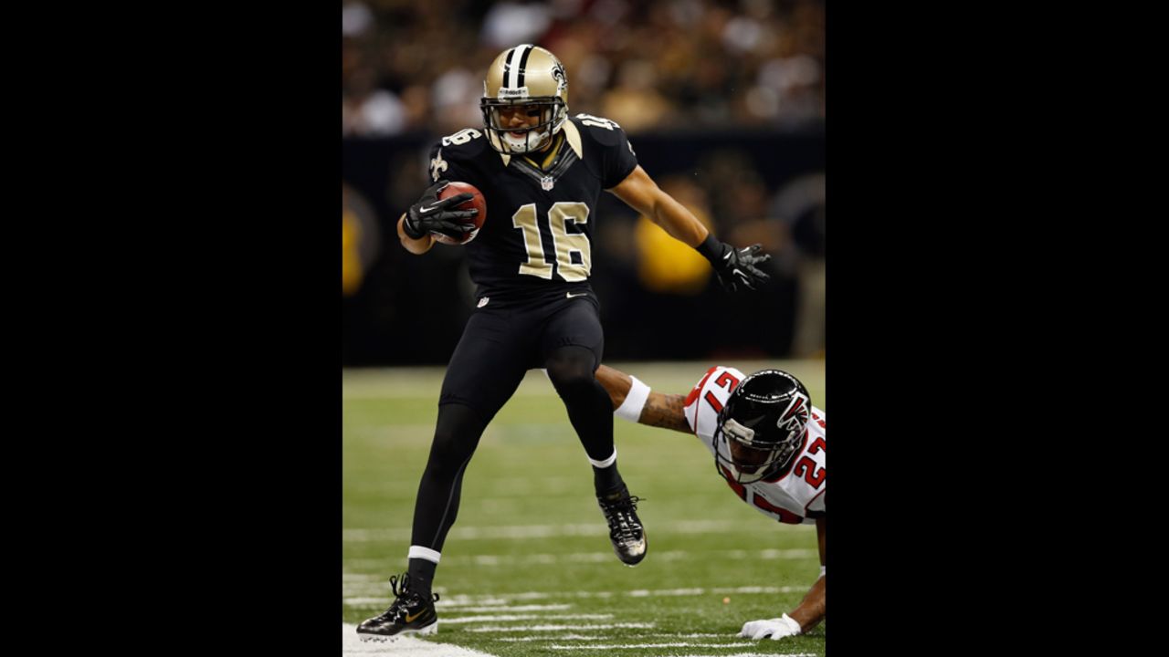 Lance Moore of the Saints is pushed out of bounds by Robert McClain of the Falcons on Sunday.
