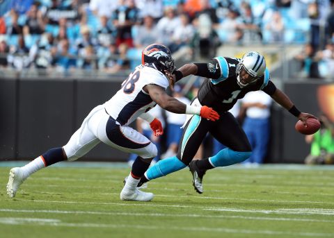 Von Miller of the Broncos tackles quarterback Cam Newton of the Panthers during their game on Sunday.