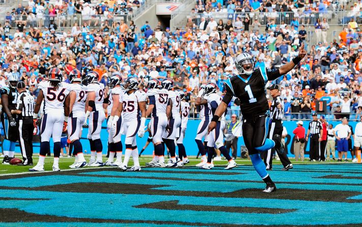 Cam Newton of the Panthers reacts after his team scores a touchdown against the Broncos on Sunday.