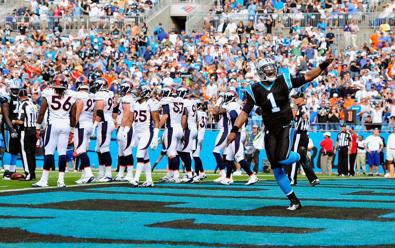 Cam Newton of the Panthers reacts after his team scores a touchdown against the Broncos on Sunday.